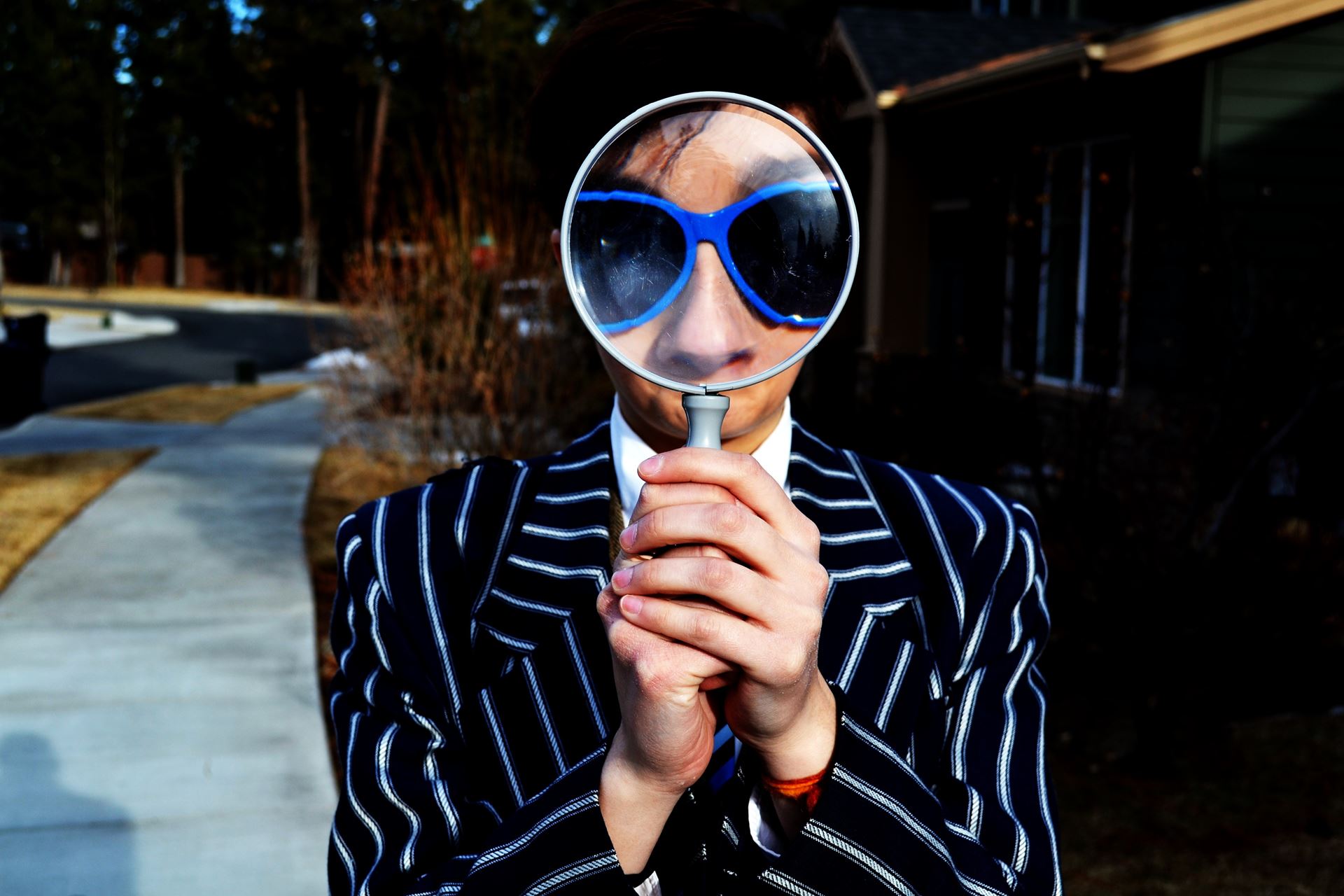 a person wearing sunglasses taking a selfie